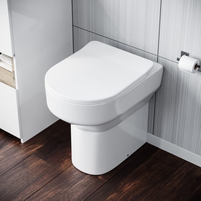 Modern White Comfort Height Back to Wall Toilet with Soft Close Seat - Image 4